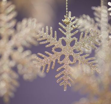 Gold Christmas snowflakes close up with copy space