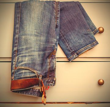 Jeans protrudes from the drawer. instagram image style