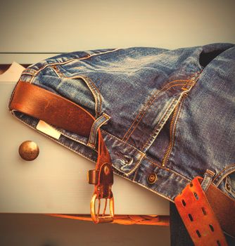 aged jeans sticking out of a drawer. instagram image style