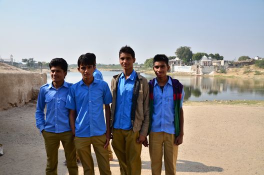 Jodhpur, India - January 2, 2015: Group of young indian men poses proudly in Jodhpur, India. Jodhpur is the second largest city in the Indian state of Rajasthan with over 1 million habitants.