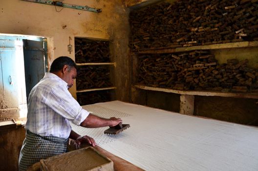 Jodhpur, India - January 2, 2015: Textile worker in a small factory on January 2, 2015 in Jodhpur, India. The textile industry continues to be the second largest employment generating sector in India.