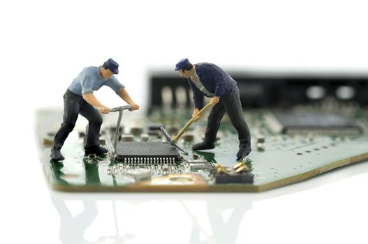 two man repair chips on computer motherboard