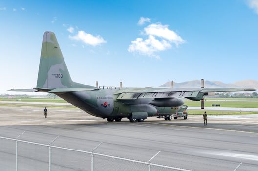 Busan, South Korea - 22 June 2011:  A South Korean C-130 being towed after doing an engine test.