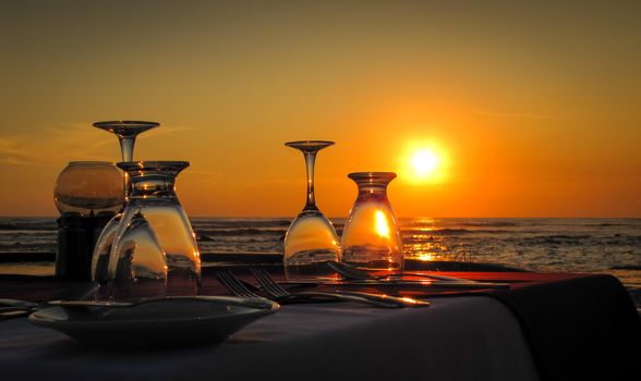 Sun goes down on a beach and salt water pool at a resort in El Salvador, Central America.