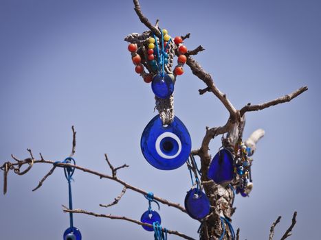 Evil eye hanging from a branch in Cappadocia Turkey