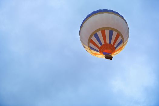 Air balloon flying in the sky. Horizontal photo