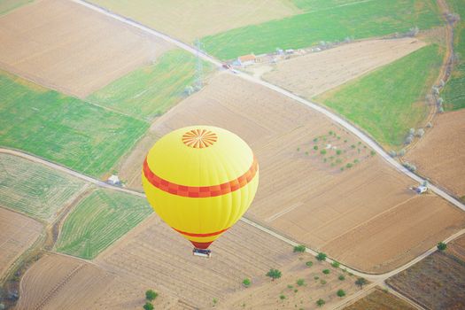 Air balloon flying above the land. Horizontal photo