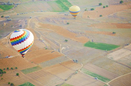 Air balloon flying above the land. Horizontal photo