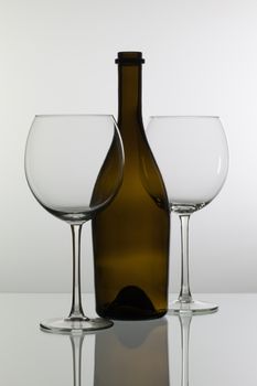 Empty wine glasses on the glass desk