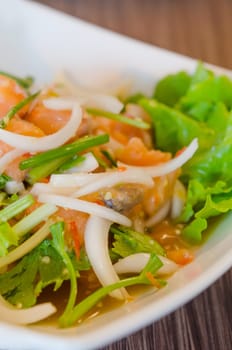 Spicy salmon salad with mixed vegetable and herb