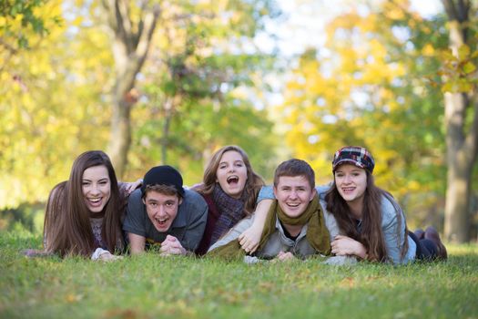 Five caucasian teenagers enjoying the outdoors together