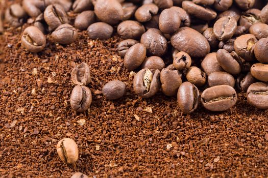 Picture of a group of coffee beans with coffee powder
