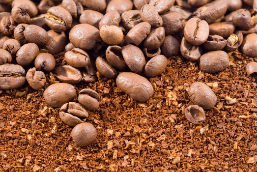 Picture of a group of coffee beans with coffee powder