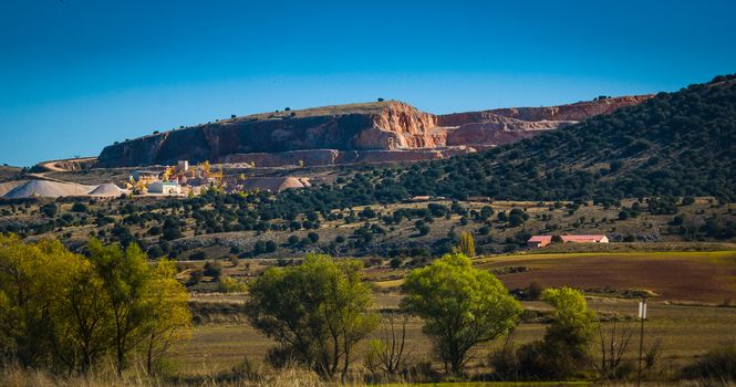 A quarry conducts its stone and gravel making operations in Spain