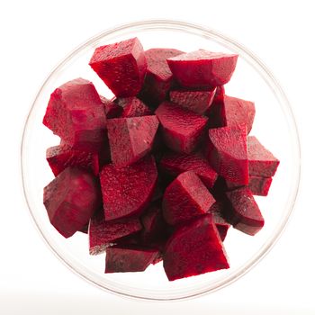 Beetroot wedges in glass bowl isolated on white.