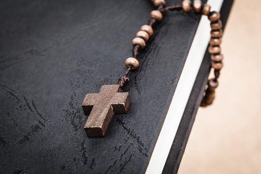 Christian cross necklace on Holy Bible book, Jesus religion concept as good friday or easter festival