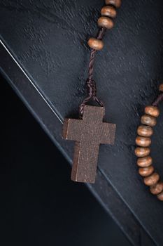 Christian cross necklace on Holy Bible book, Jesus religion concept as good friday or easter festival