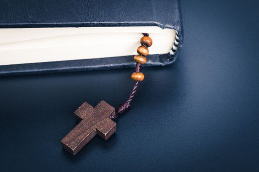 Christian cross necklace on Holy Bible book, Jesus religion concept as good friday or easter festival