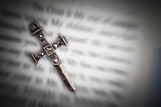 Christian cross necklace on Holy Bible book, Jesus religion concept as good friday or easter festival