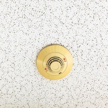 Smoke detector and red alert on ceiling