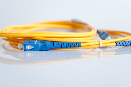 Fiber optical patch cord with plugs isolated on white background