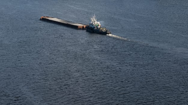 The barge floating in the blue Dnieper waters.