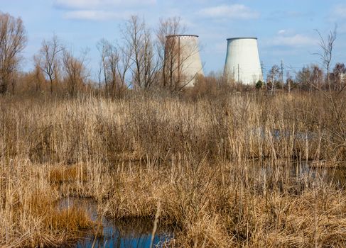 Two cooling towers of the cogeneration plant near Kyiv, Ukraine. Industrial landscape.