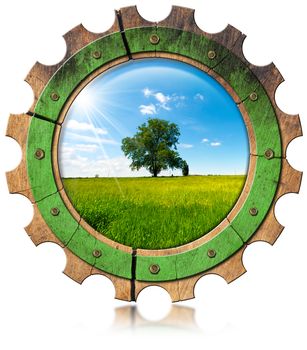 Wooden gear with green tree in countryside, concept of green economy. Isolated on white background
