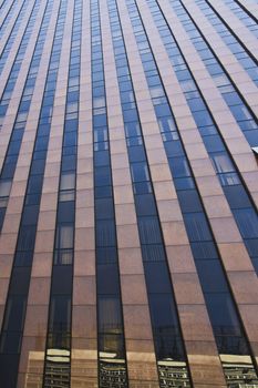 Modern building with glass facade in blue