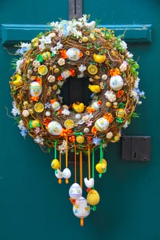 Colorful easter egg decorative wreath on door