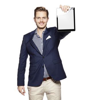 Portrait of a cheerful young businessman holding a blank digital tablet.