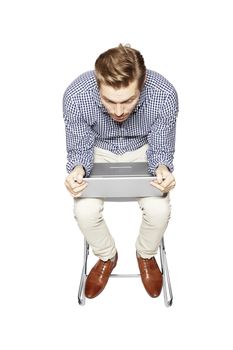 Young man leaning over the keyboard.