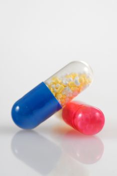 Medicine pills over white background