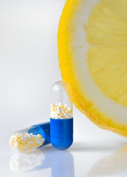 vitamin c pills and lemon slice