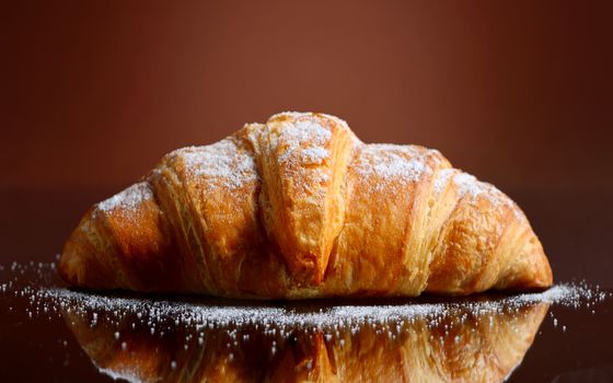Fresh and tasty croissant with butter