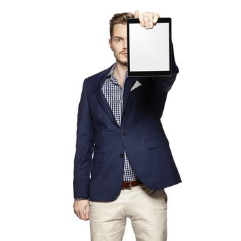 Portrait of young businessman holding a blank digital tablet.