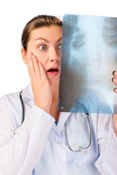 Shocked doctor with x-ray ill patient