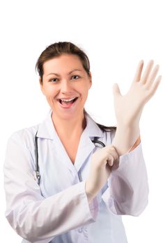 cheerful woman doctor puts on a rubber glove