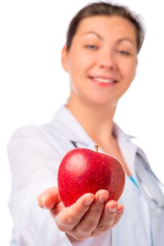 nurse stretches ripe apple for health, isolated