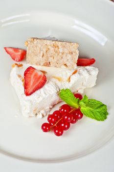 cream dessert with berries cranberries and strawberry