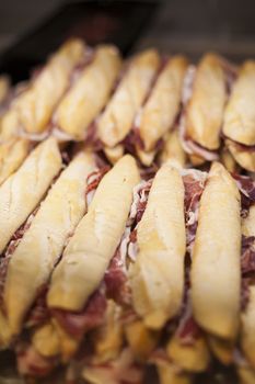 lot of iberian ham panini french bread sandwiches stacked ready to eat