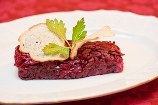 beet salad with rusk bread at plate
