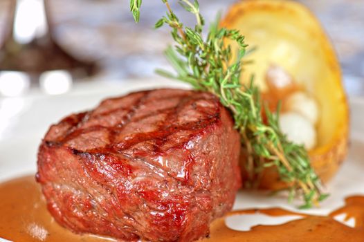 grilled beef steak with herbs and vegetables