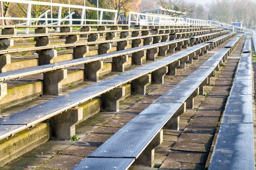 Rows of seats, chairs, benches for a sporting event.
