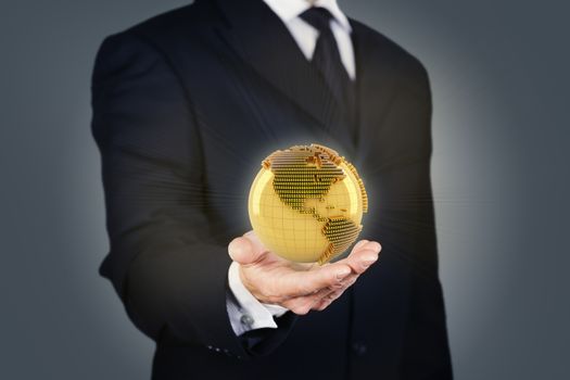 Composite image of a businessman holding a golden globe