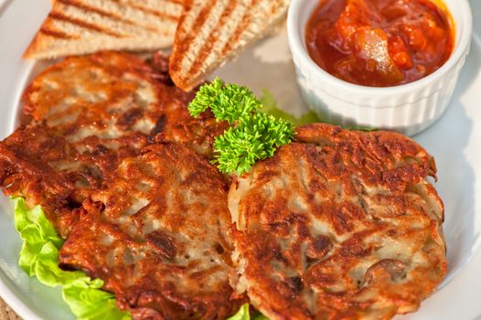 potato pancakes with  toast bread and jam closeup