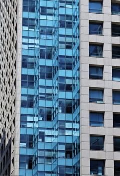 Modern building with glass facade in blue