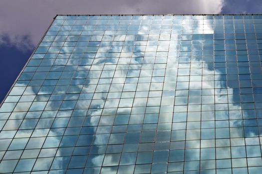 Modern building with glass facade in blue