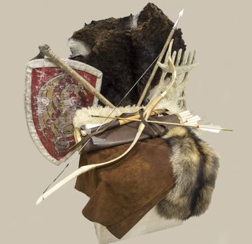 Bow,quiver of arrows,an axe and a shield,the skins of animals.