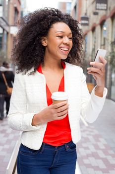 young woman reading her text messages.